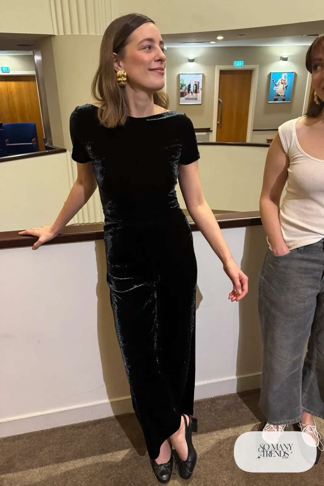 black velvet wide-leg jumpsuit, thin gold belt, chunky gold earrings, black pumps, long wool coat, nutcracker outfit 19