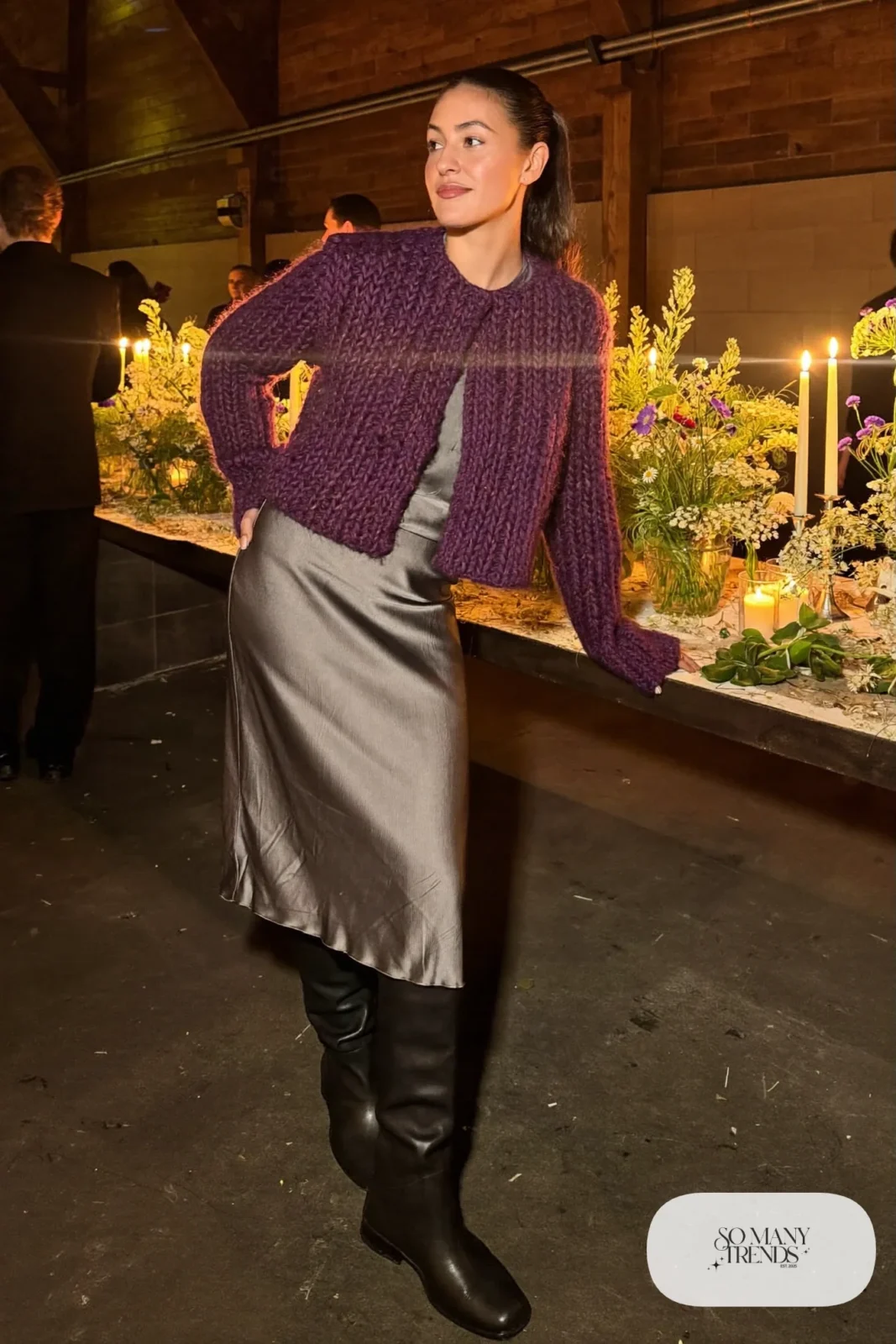 slate gray satin midi skirt, plum chunky knit cardigan, tall black boots, sheer tights, long gray wool coat, winter wedding guest outfit 5