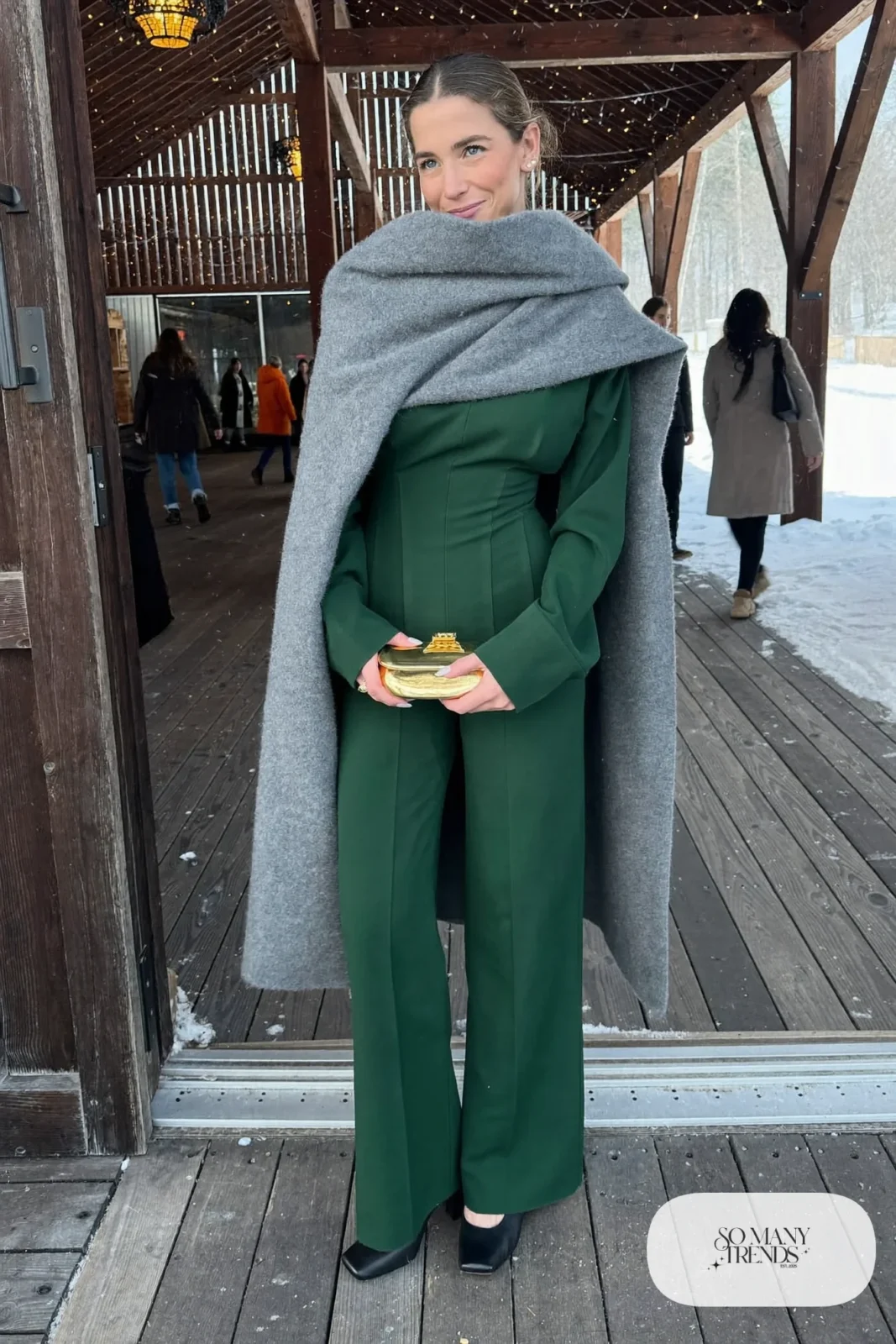 forest green long-sleeve wide-leg crepe jumpsuit, large wool wrap, black block-heel pumps, small clutch, winter wedding guest outfit 6