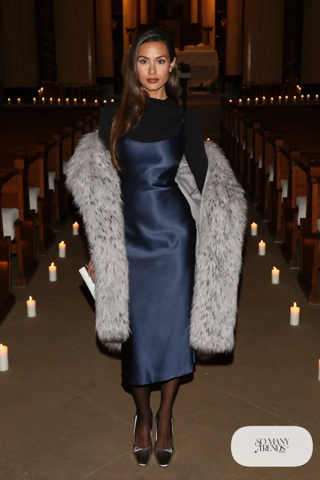 midnight blue satin bias-cut slip midi dress, gray faux fur stole, black closed-toe pumps, sheer tights, long wool coat, winter wedding guest outfit 12