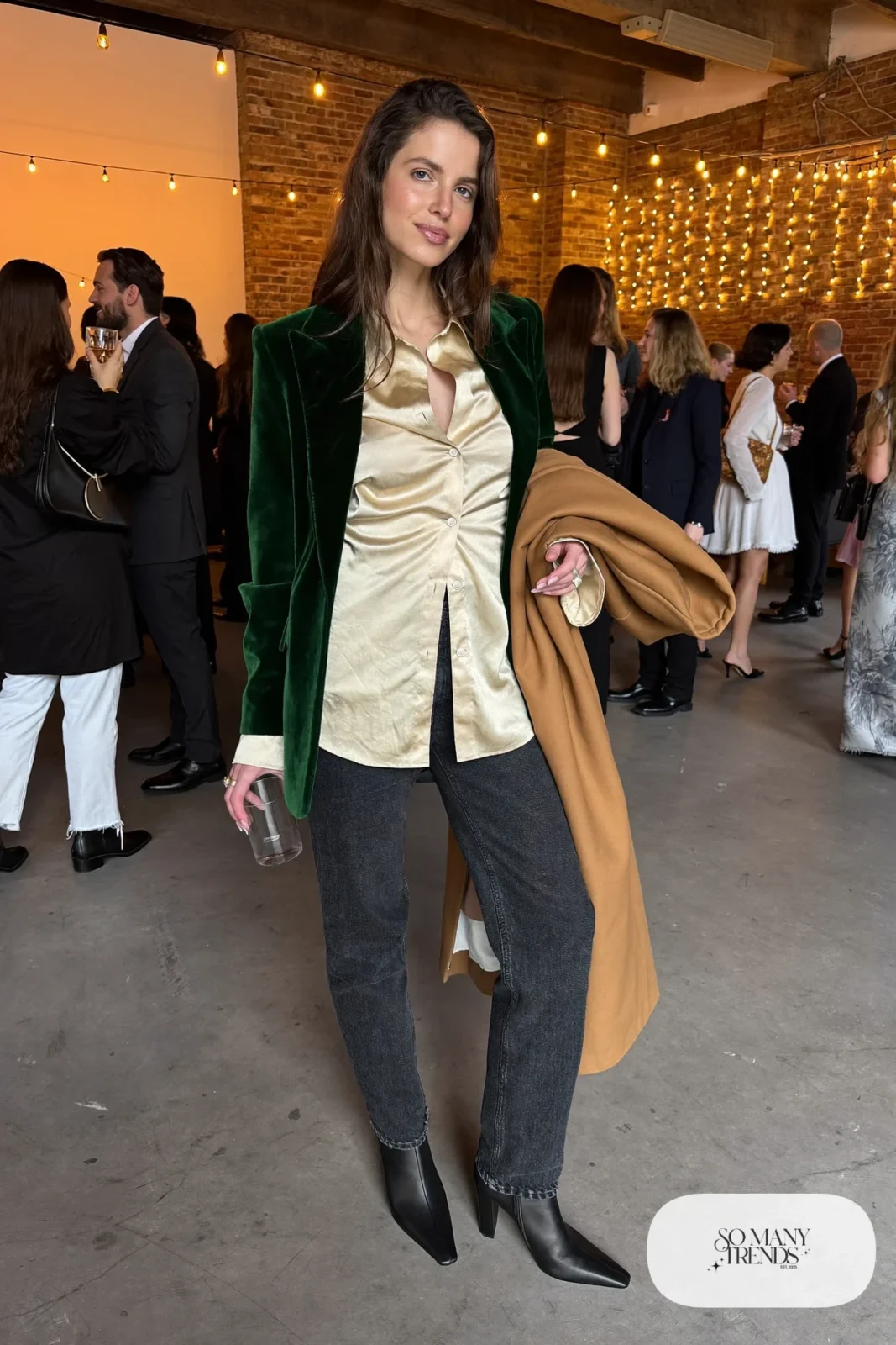 dark straight-leg jeans, champagne silk blouse, deep green velvet blazer, pointed block-heel boots, long coat, winter wedding guest outfit 24