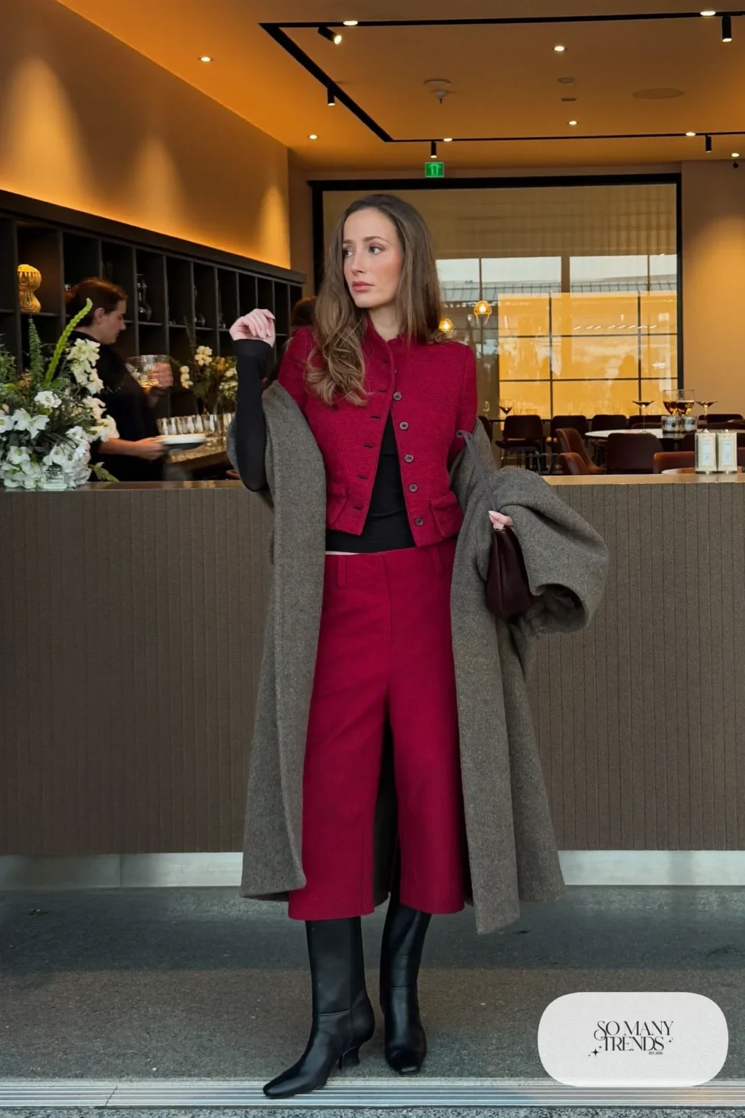 burgundy crepe cropped jacket and mid-calf culotte set, fitted black knit top, tall black boots, long wool coat, winter wedding guest outfit 25