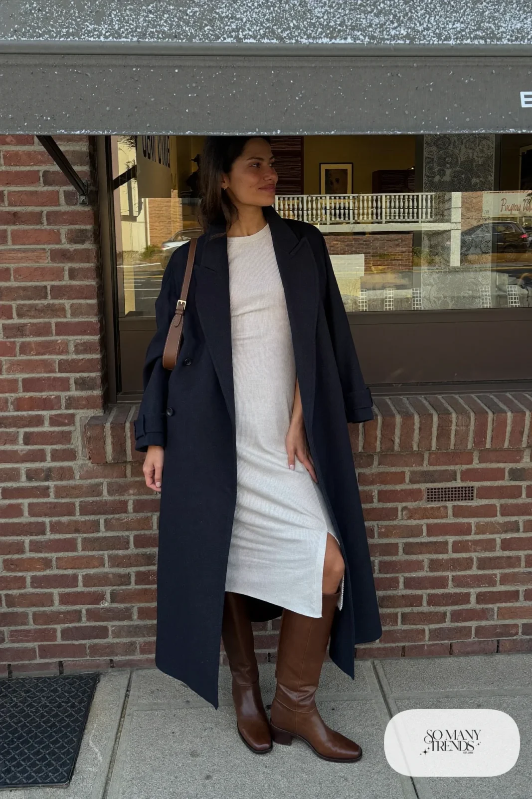 Look 10: navy wool long coat, ivory ribbed knit midi dress, brown tall boots and a leather shoulder bag