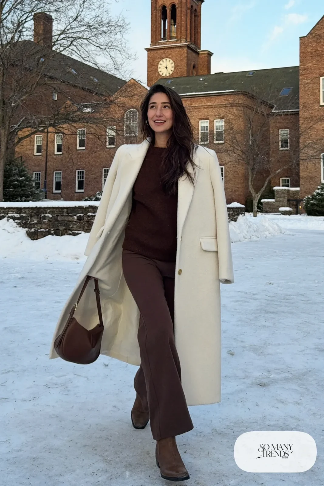 Look 20: long winter white wool coat, chocolate brown knit sweater, brown wide-leg pants and brown leather boots