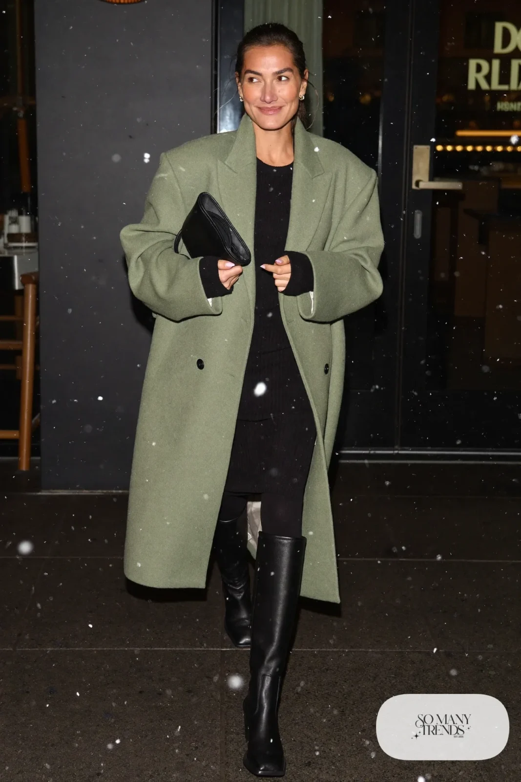 Look 22: long sage green wool coat, black knit midi dress, black opaque tights and black tall boots