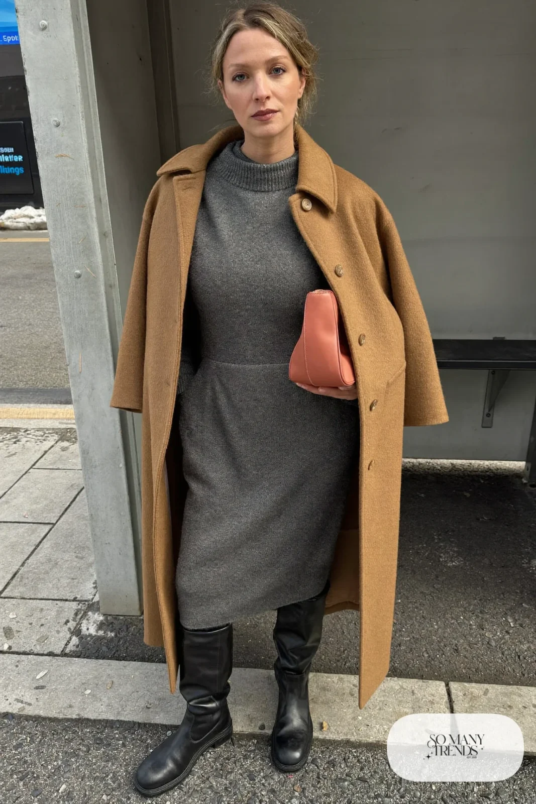 Look 26: gray knit midi dress with high neck, black tights, black tall boots, long camel coat and coral leather bag