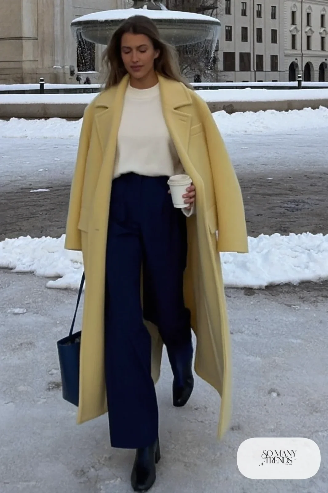 Look 27: butter yellow wool coat, white knit sweater, navy wide-leg pants and black boots