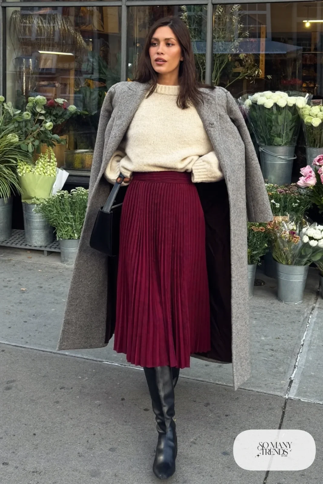 Look 29: burgundy pleated midi skirt, cream chunky sweater, black tall boots and long gray coat