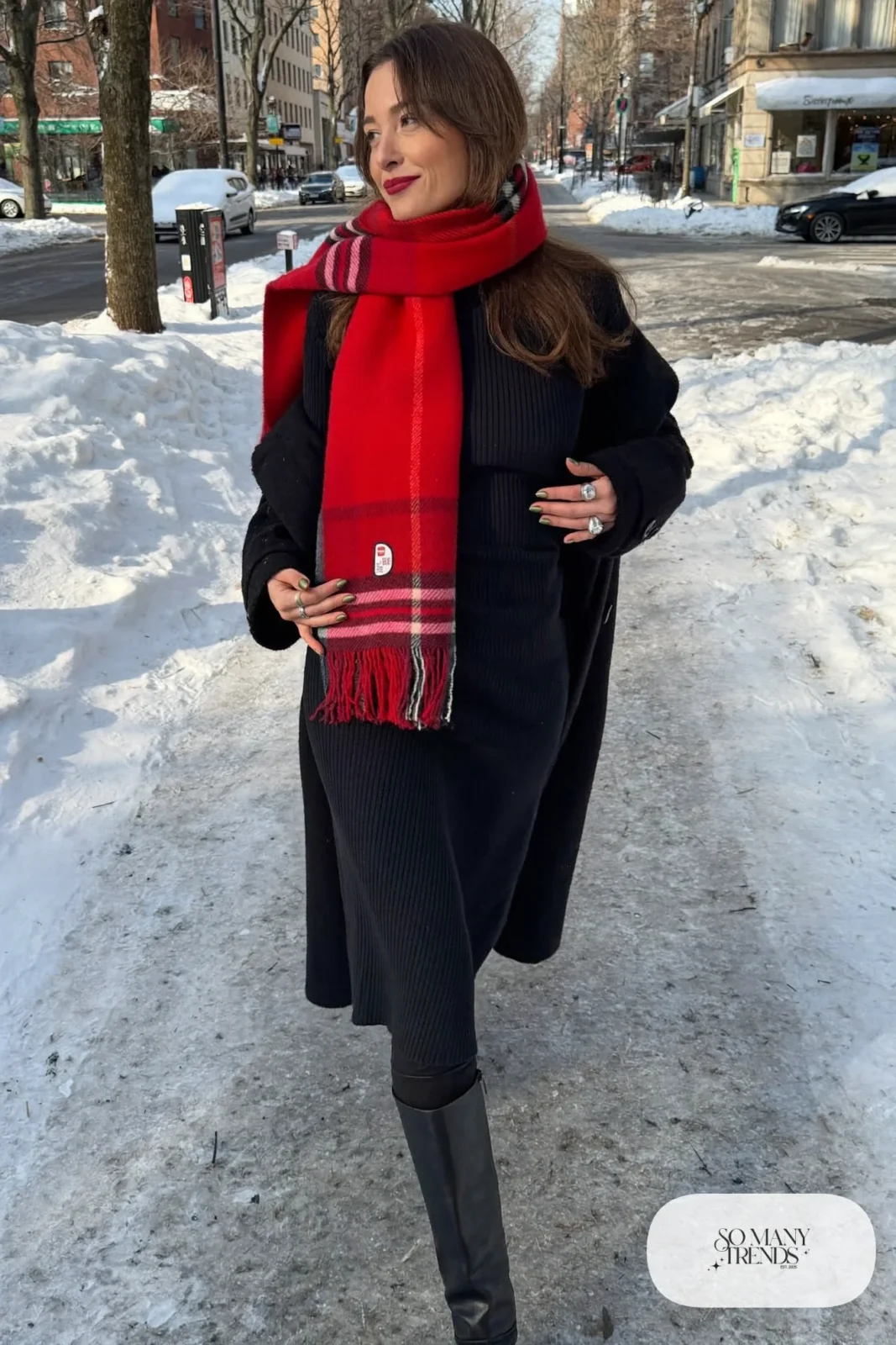 Woman in a black ribbed knit midi dress, red plaid scarf, wool coat, tights and tall black boots, outfit 34
