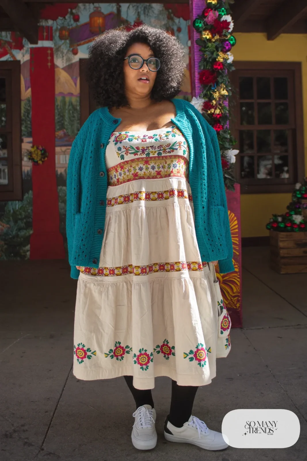 Cream embroidered tiered dress with teal cardigan, round glasses and white sneakers, outfit 17