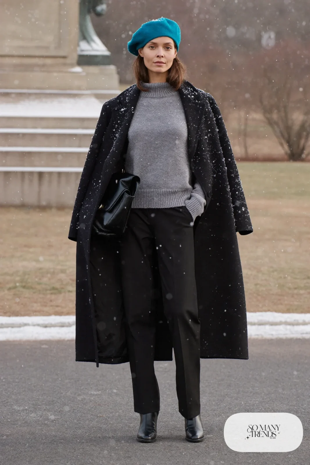 Woman in a teal wool beret, black coat, gray sweater, black pants and black boots, outfit 18