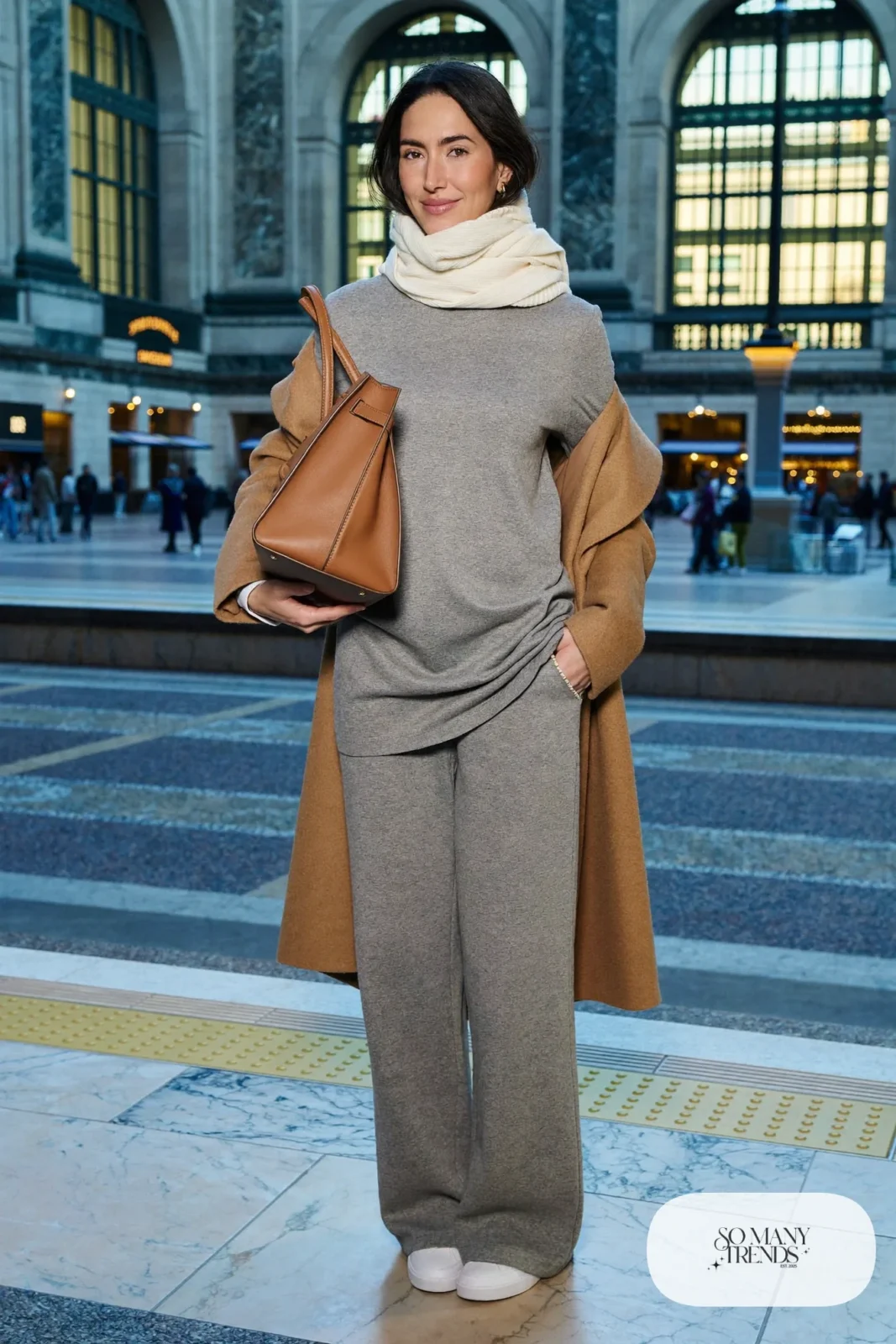 Woman in a gray knit set with wide-leg pants, a long camel coat and white leather sneakers, outfit 25