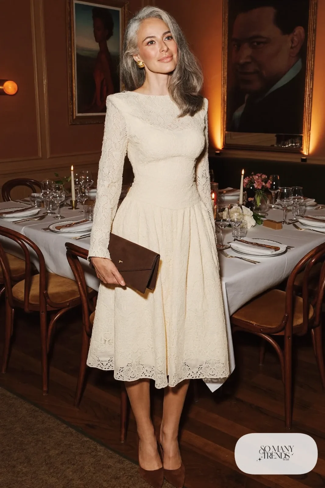 Woman in a cream lace long-sleeve midi dress with a fitted bodice and brown suede pumps, outfit 20