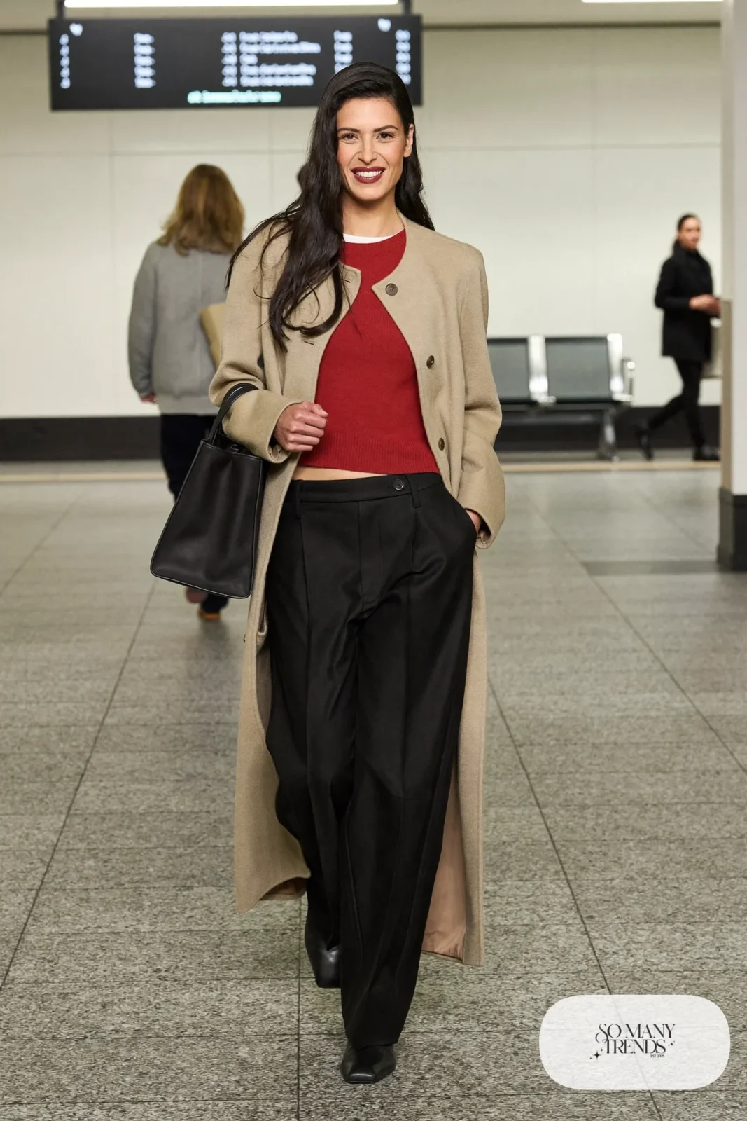 Woman in black pull-on wide-leg pants, tomato red fitted knit, camel cardigan coat and black boots, outfit 15