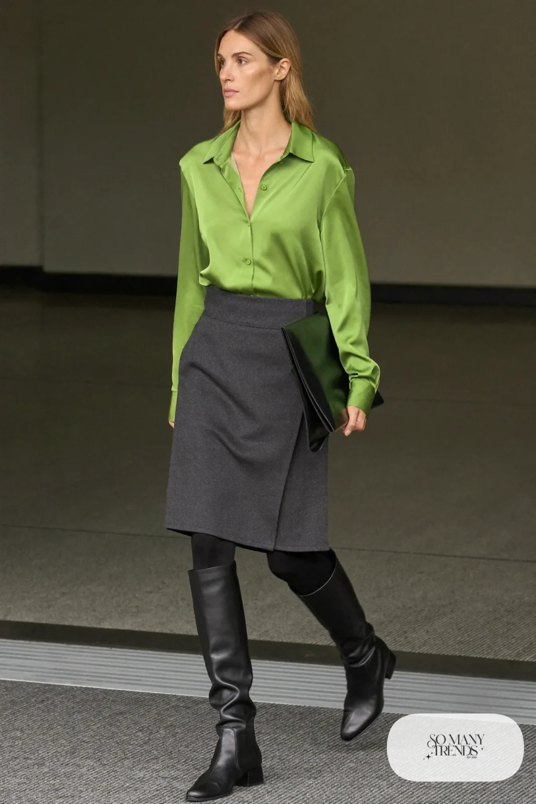 Woman in pine green blouse, charcoal wool midi skirt, black tights and black boots, outfit 20