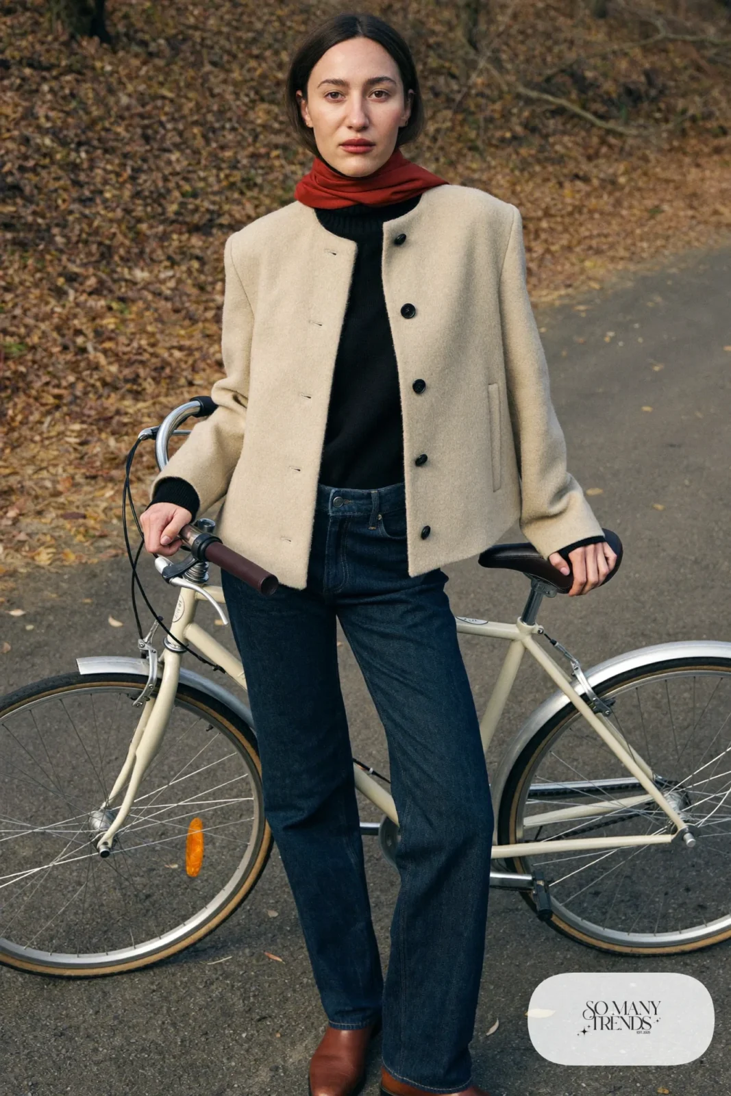 Woman in oatmeal boiled wool jacket, black turtleneck, dark jeans and brown boots with red scarf, outfit 8