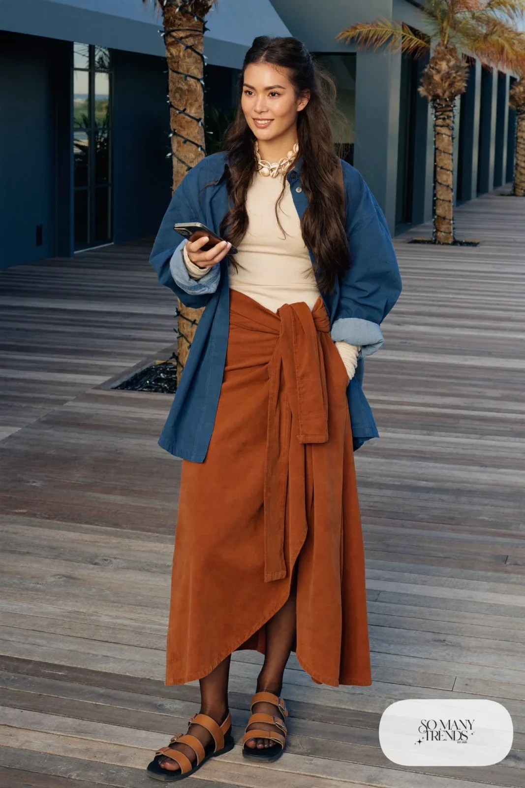 Terracotta wrap midi skirt with cream top, indigo overshirt and woven necklace with comfortable tan sandals, outfit 14