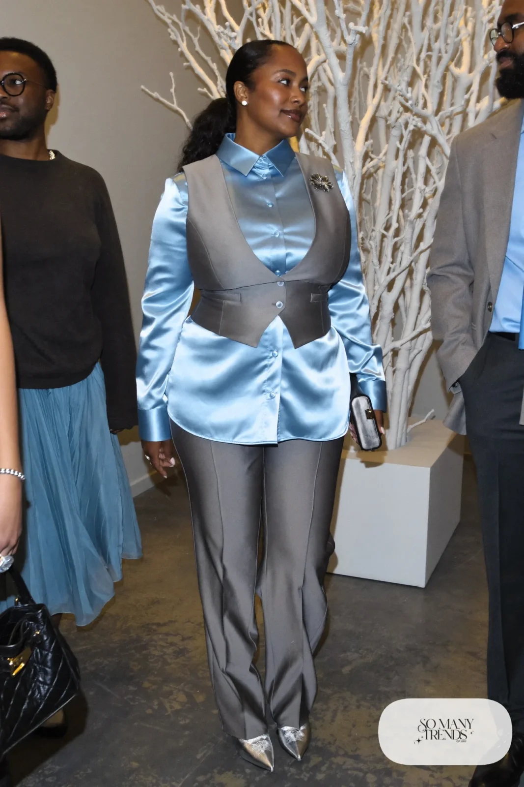 Steel gray tailored vest and straight pants set with icy blue satin blouse, silver brooch and silver pointed shoes, outfit 27