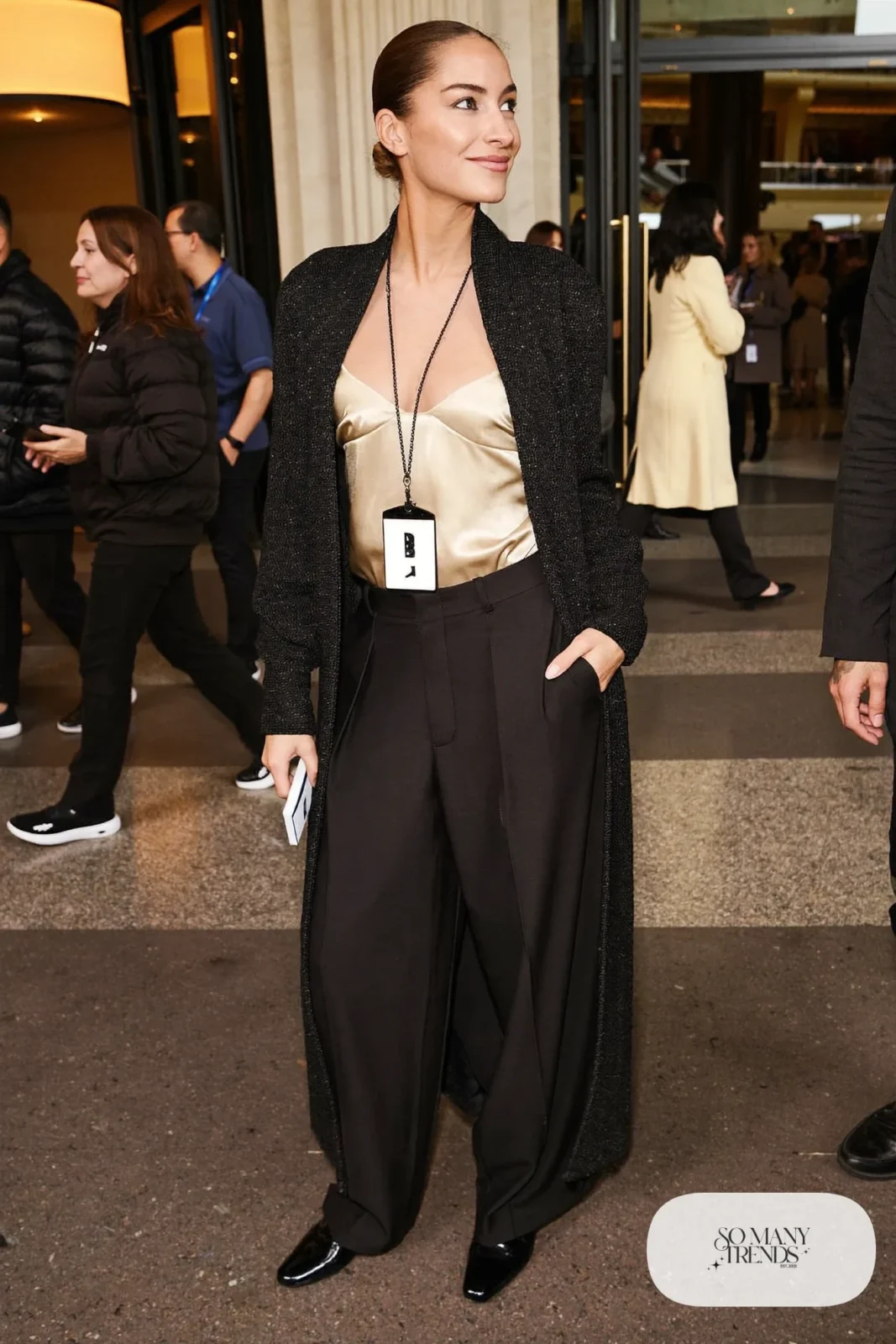 Long black cardigan over champagne camisole with black wide-leg pants and loafers, outfit 15