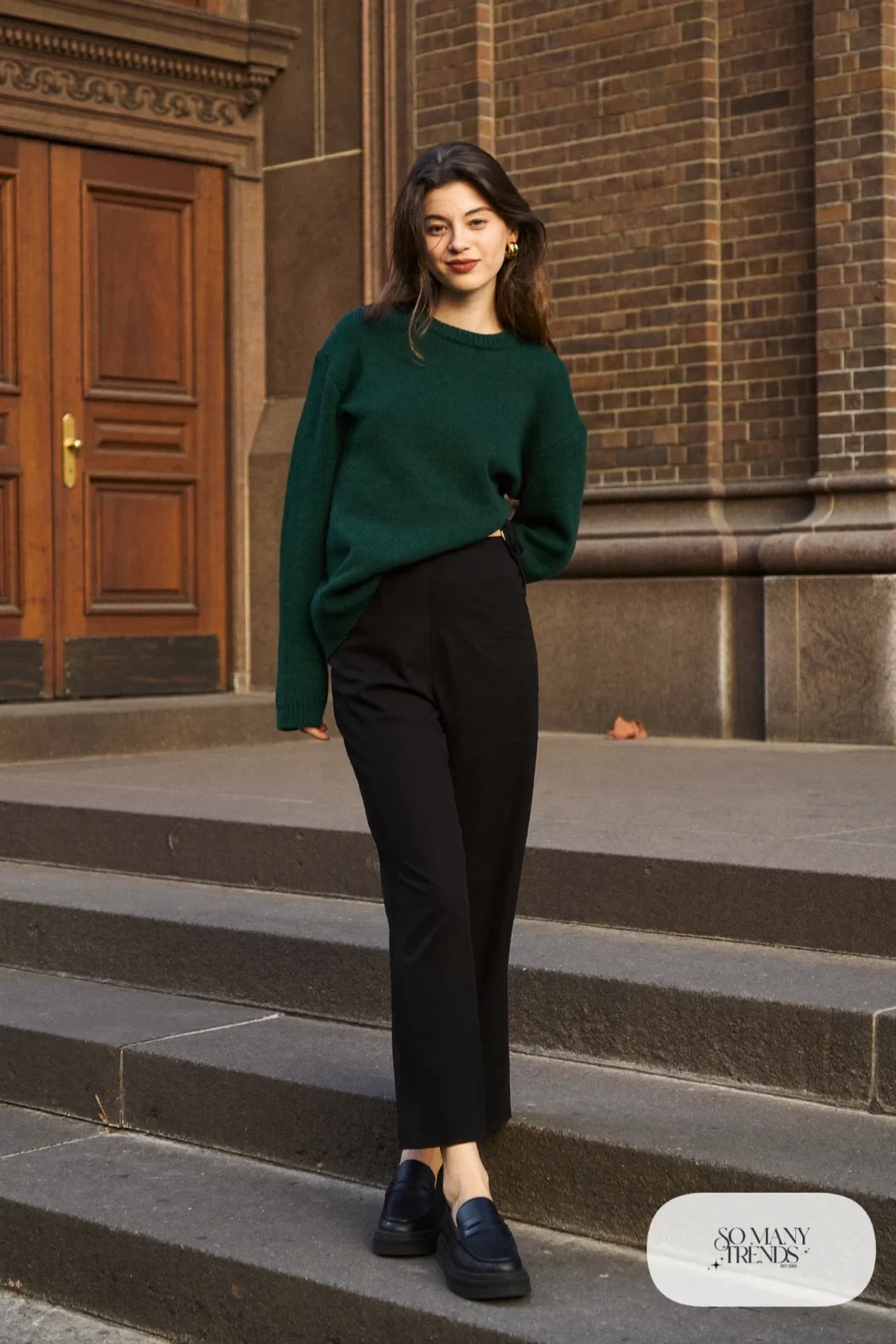 Forest green ribbed hip-length sweater over black wide-leg pants with loafers, outfit 16