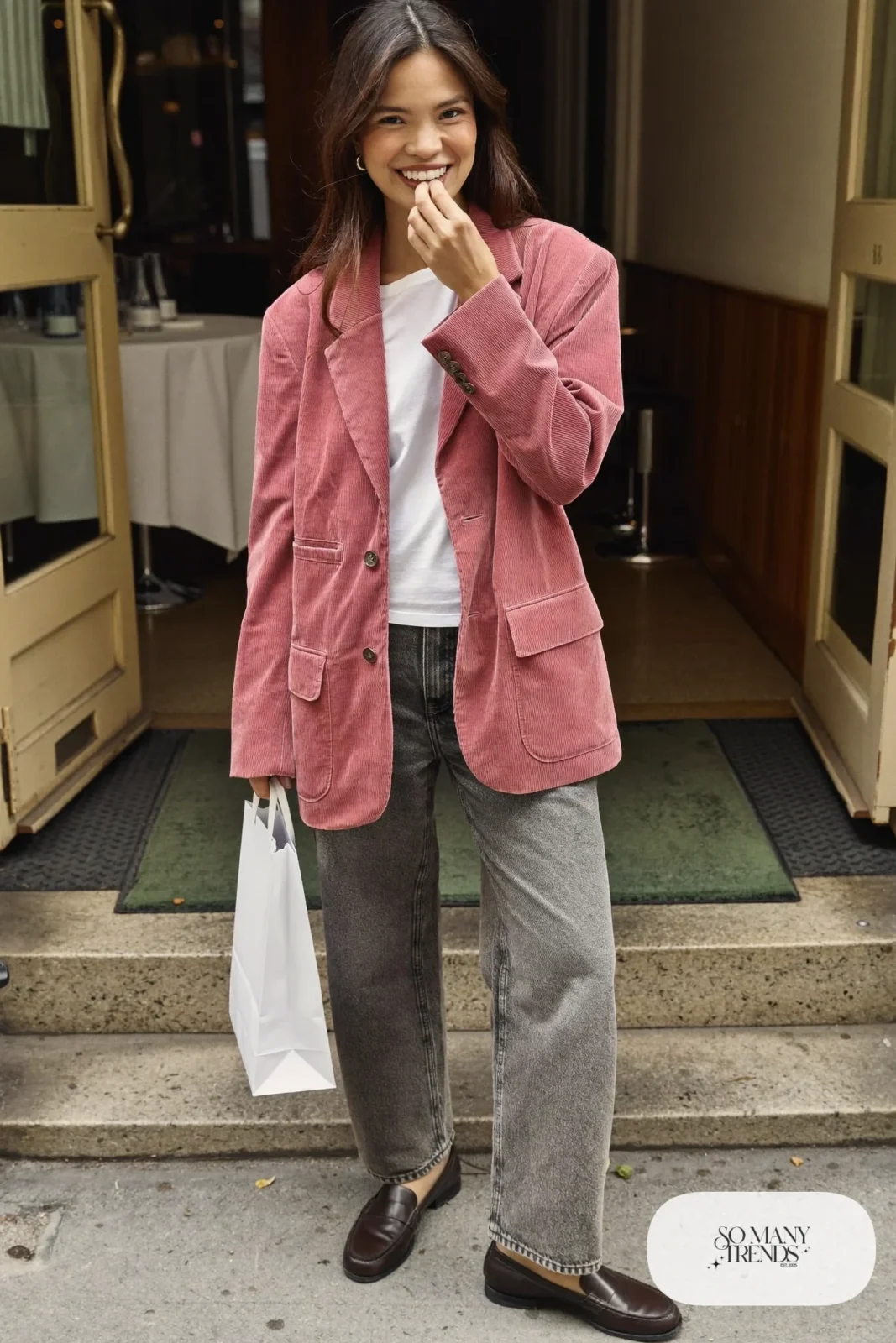 Woman in a dusty pink corduroy blazer, white tee, washed gray straight jeans and brown loafers, outfit 20