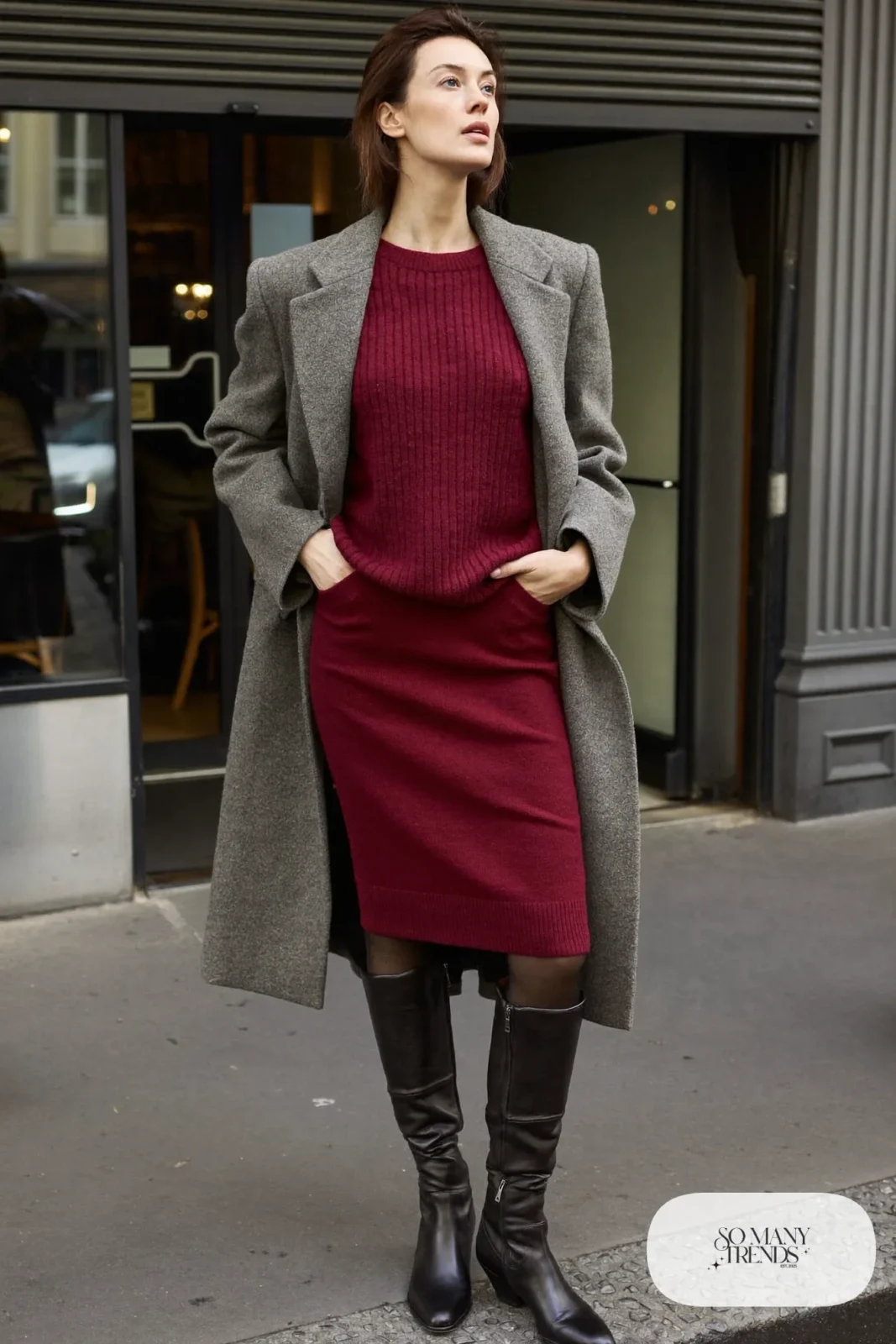 Woman in a burgundy knit sweater and midi skirt set, long gray coat and black tall boots, outfit 25