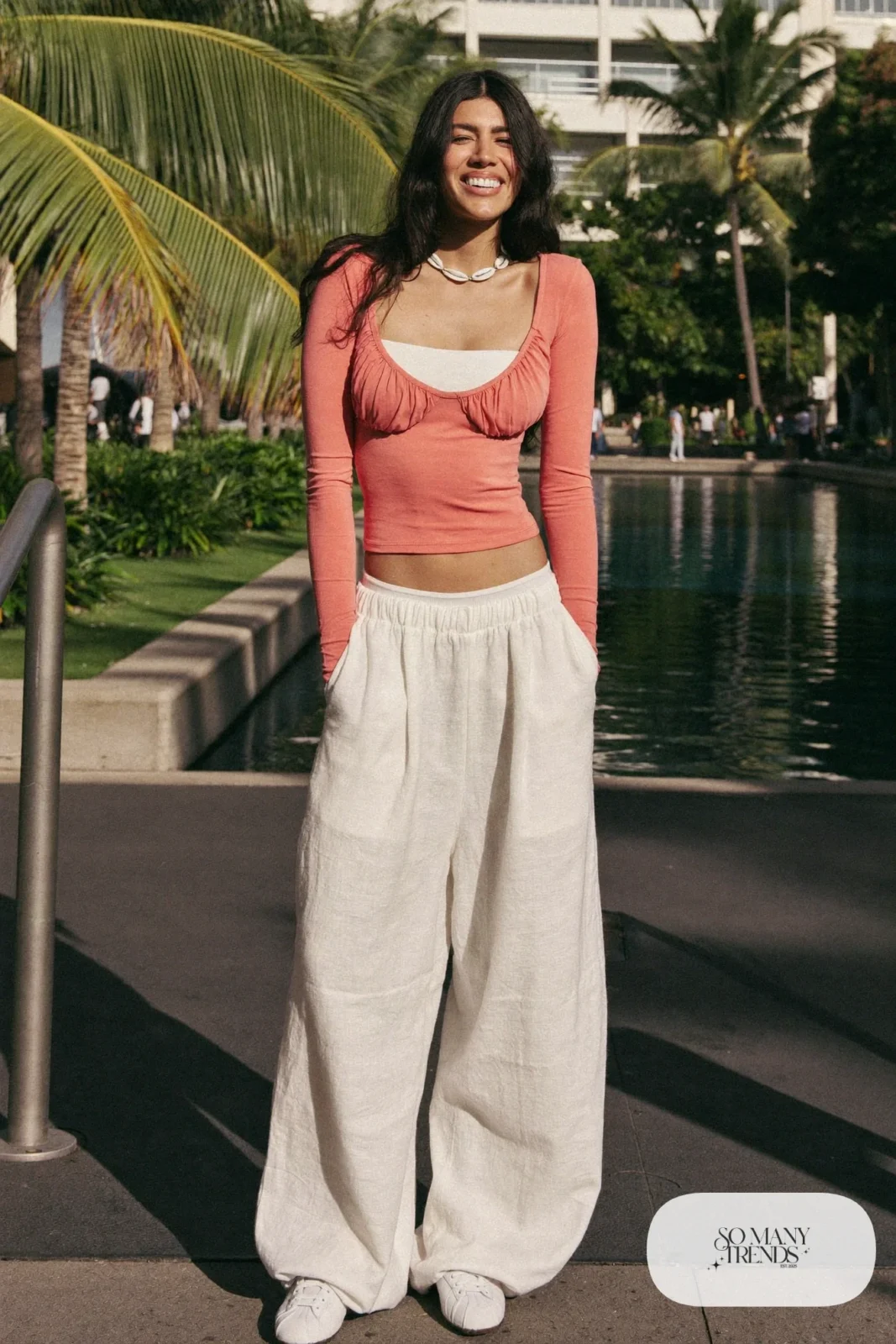 Coral top, ivory wide-leg pants, shell necklace and sneakers, outfit 26