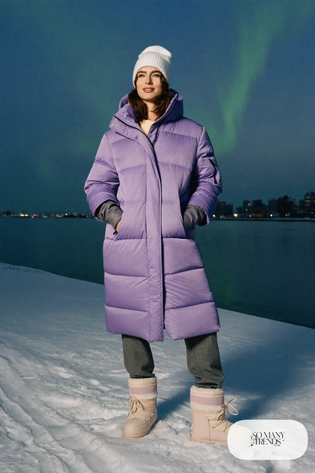 Long lilac down parka over merino base layer with dove gray pants and snow boots, outfit 1