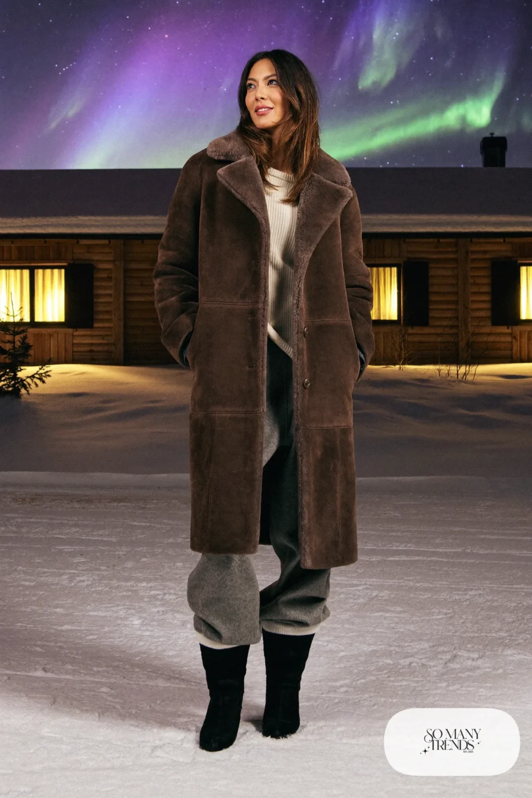 Brown shearling coat over cream cashmere sweater with wide-leg pants and snow boots, outfit 3