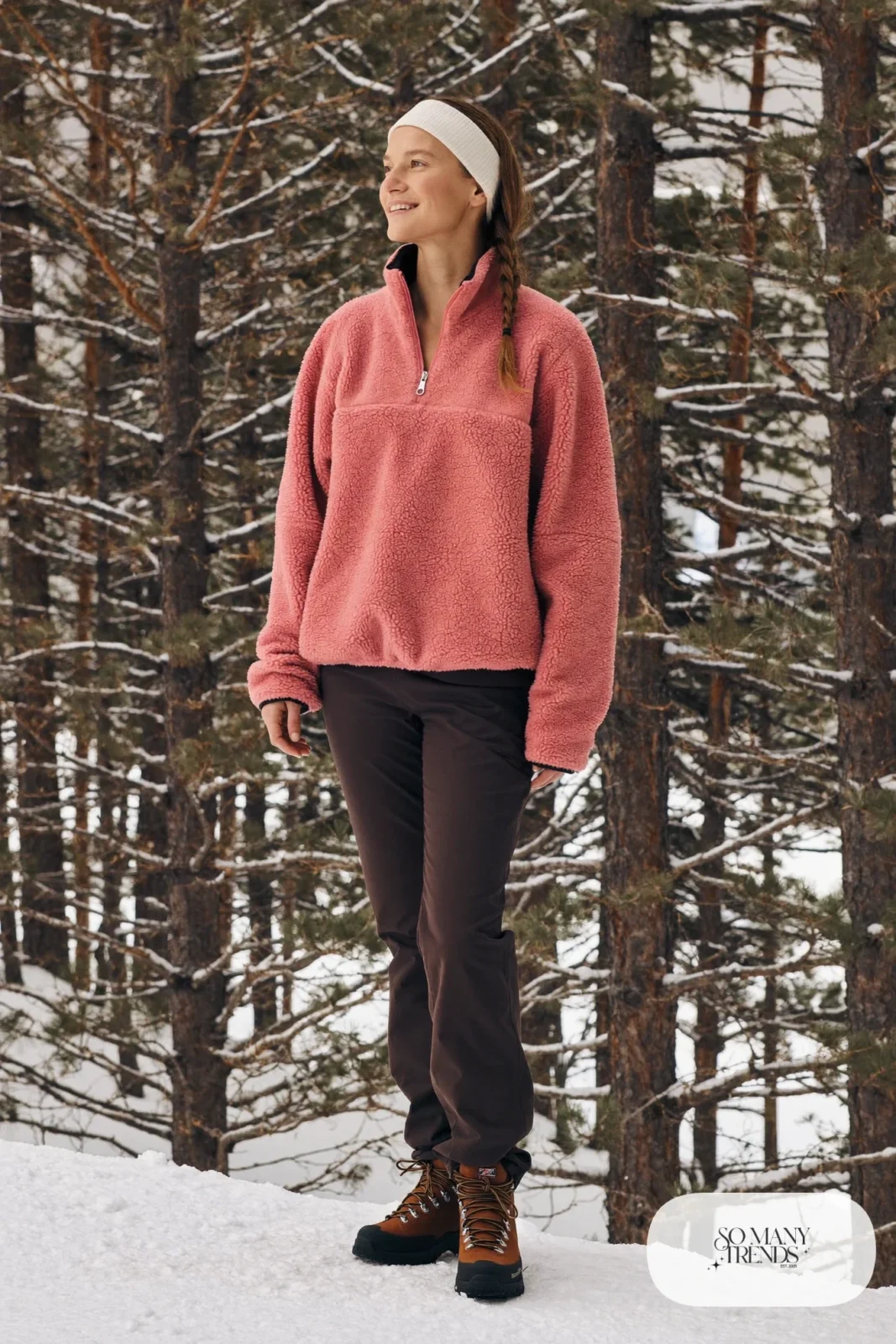 Look 7: rose half-zip fleece pullover over a base layer with charcoal hiking pants and brown hiking boots, snowy trailhead