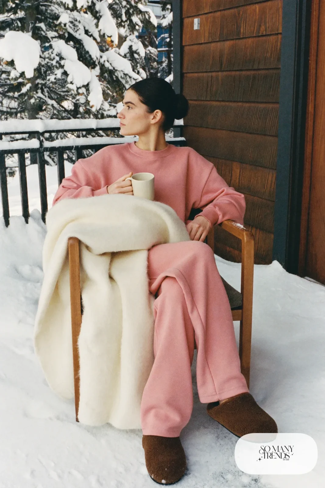 Look 21: rose heavyweight sweatshirt and straight sweatpants set with chocolate slippers, snowy cabin porch with a blanket