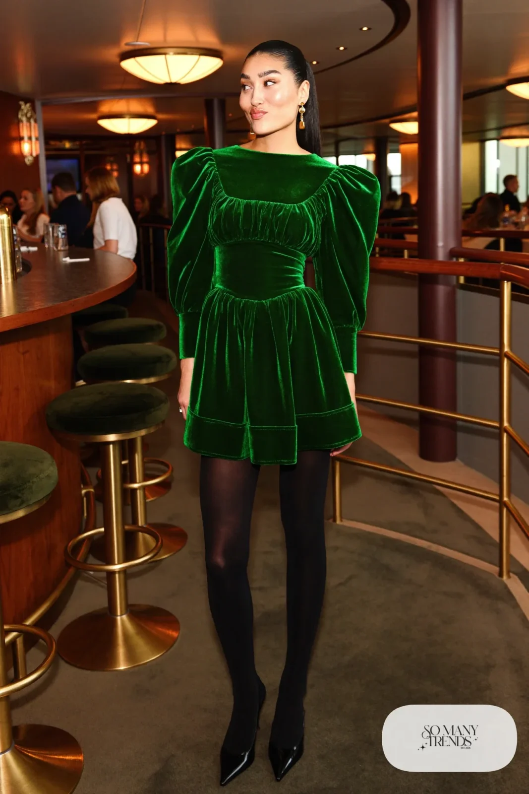 Emerald velvet mini dress with puff sleeves, sheer black hose and black pointed pumps, formal night cruise look 8