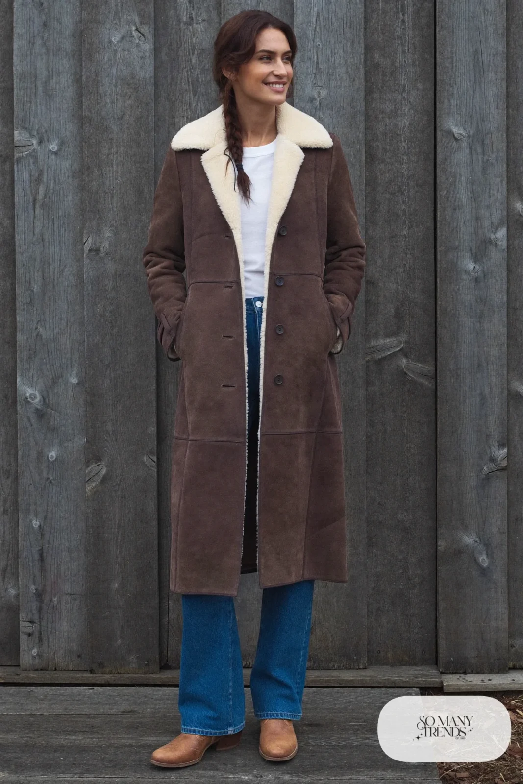 Woman in a shearling coat, white tee, straight jeans and stitched cowboy boots, outfit 13