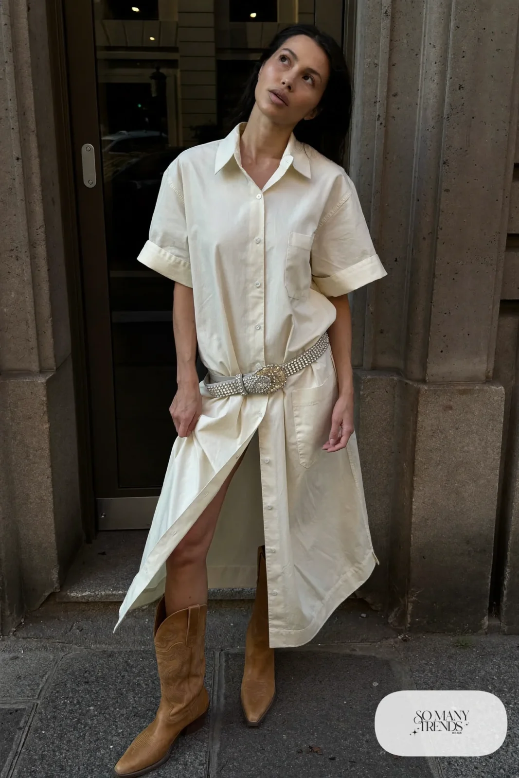 Woman in ivory shirt dress, rhinestone concho belt and tan cowboy boots, outfit 10