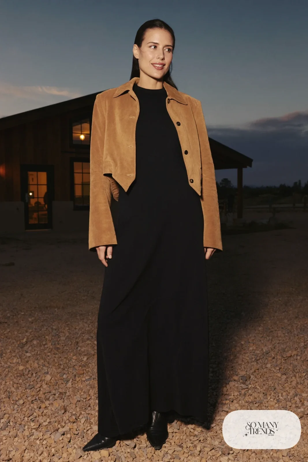 Woman in a black gown with a camel suede western blazer and pointed boots, western gala outfit 14