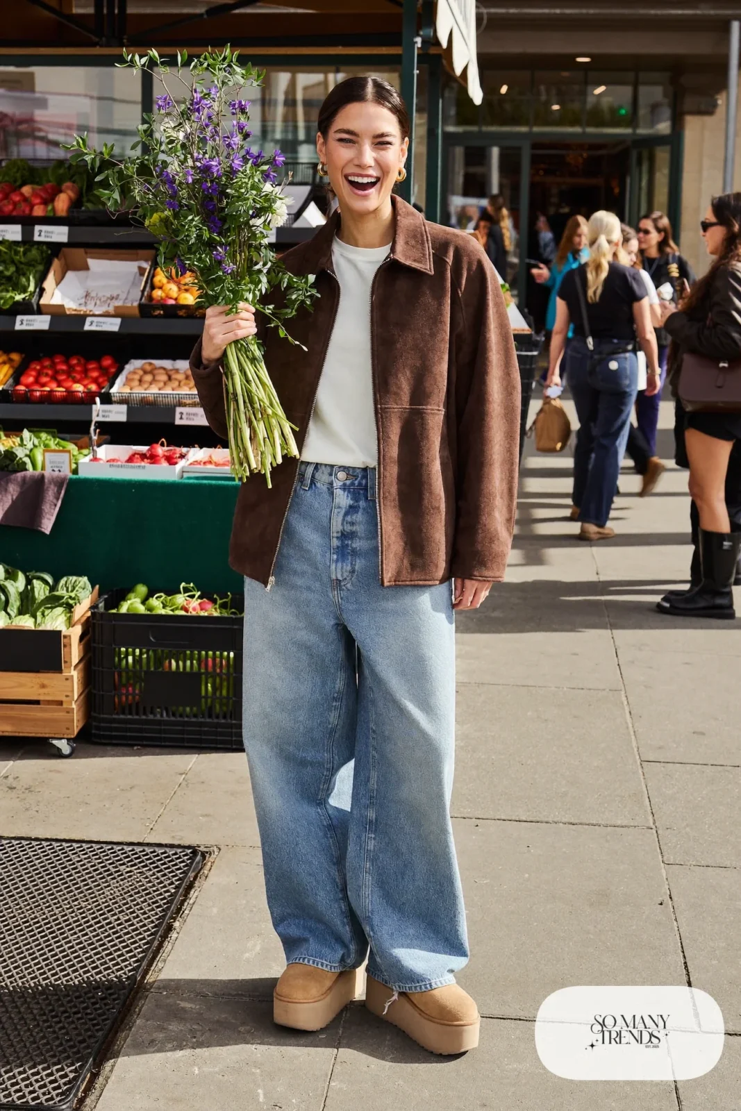 Chocolate brown suede jacket, white tee, light wide-leg jeans and sand Ugg clogs, outfit 6