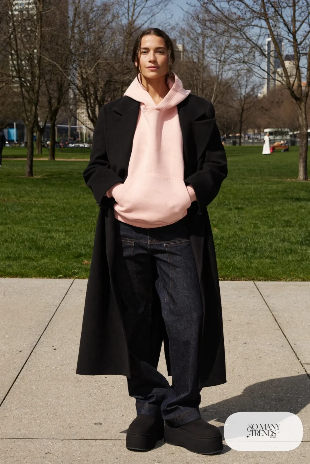 Blush hoodie, long black wool coat, dark straight jeans and black Ugg clogs, outfit 22