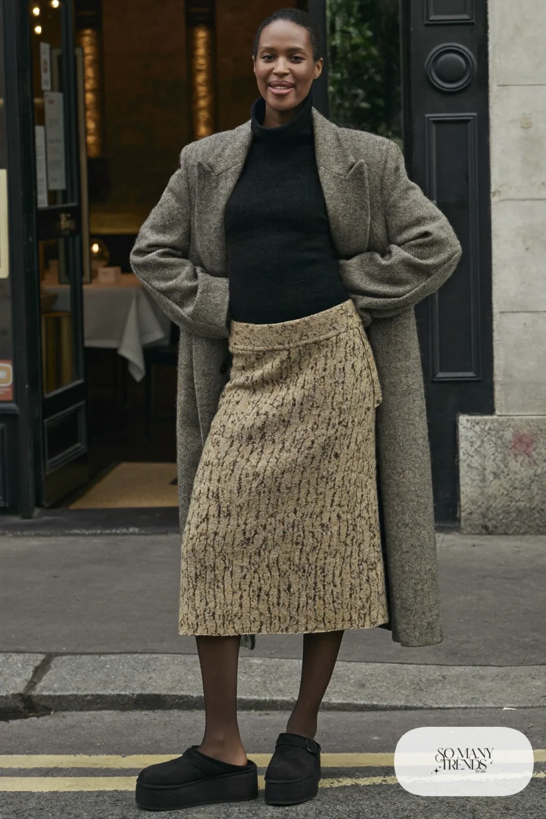 Black turtleneck, oatmeal knit midi skirt, sheer tights and black Ugg clogs, outfit 25