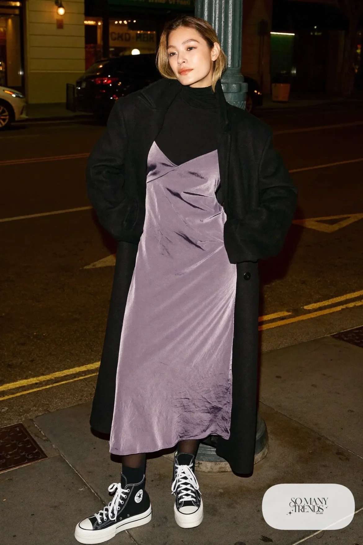Woman in a lavender midi slip dress, black turtleneck, long black coat, tights and black Converse Run Star Hike platform sneakers - outfit 21