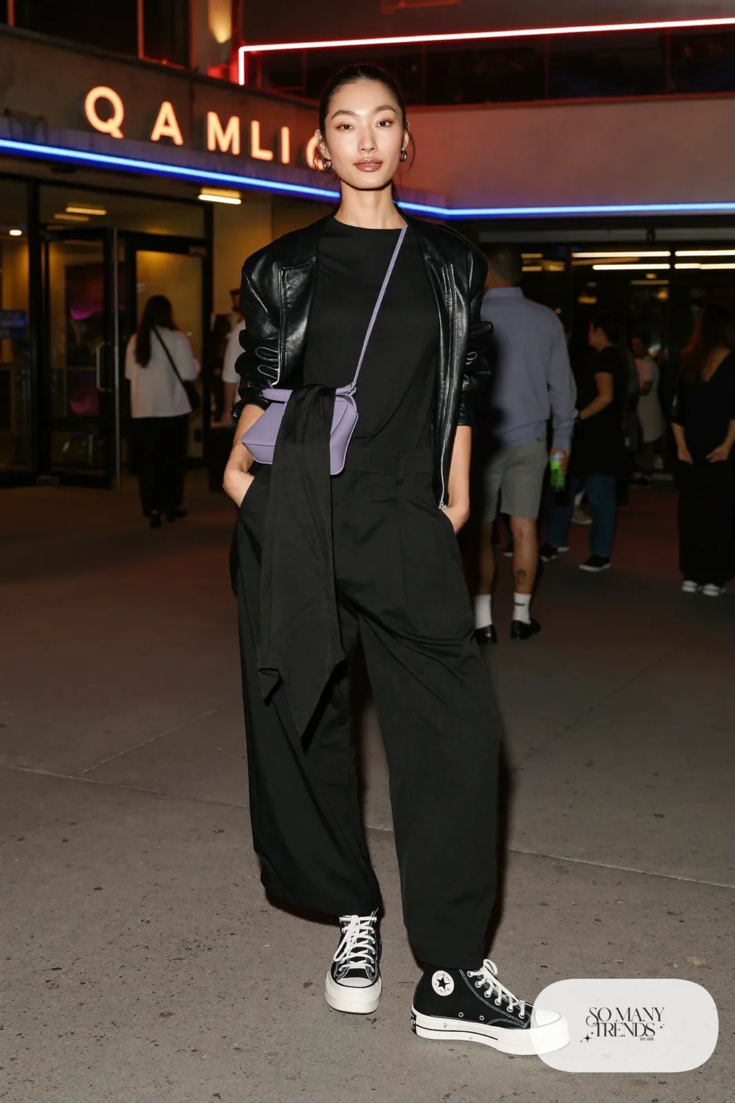 Woman in a black leather jacket, black tee, black wide pants, lavender crossbody bag and black Converse Run Star Hike platform sneakers - outfit 27