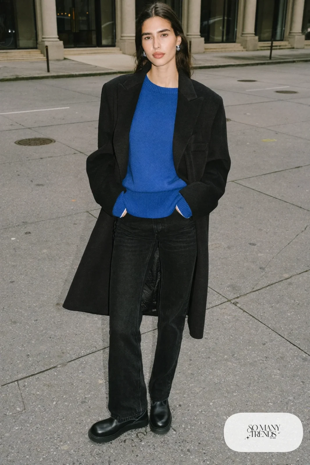 Woman in cobalt blue knit sweater, black straight jeans and black Timberland-style boots, outfit 6