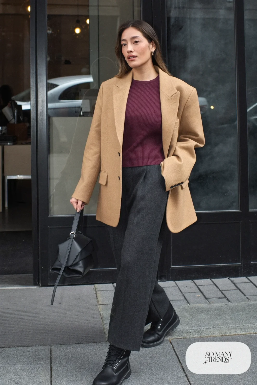 Woman in camel blazer, burgundy knit, charcoal wide-leg pants and black Timberland-style boots, outfit 19