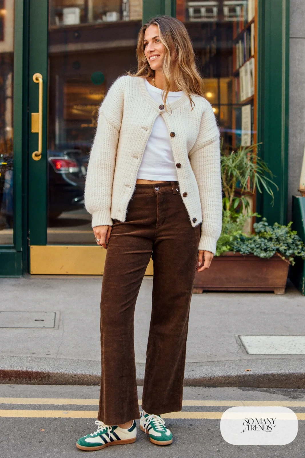 Chocolate brown corduroy straight pants, cream cardigan, white tee and low retro sneakers, outfit 3