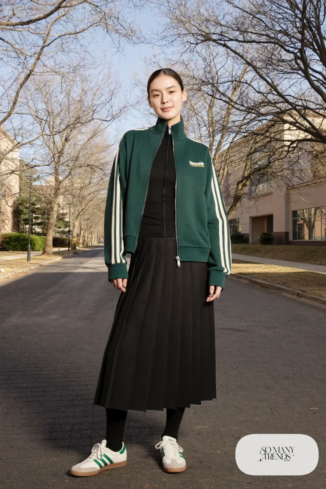 Forest green track jacket, black pleated midi skirt, black tights and low retro sneakers, outfit 26