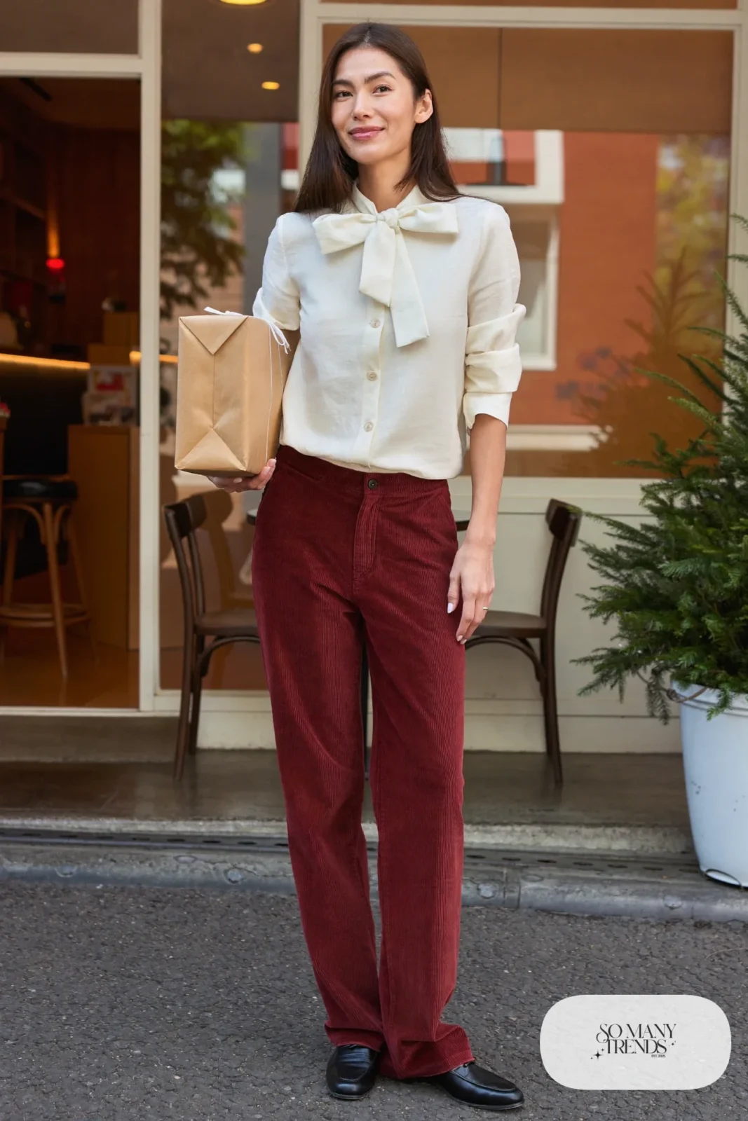 Cream blouse tucked into red corduroy straight pants with black loafers, outfit 3