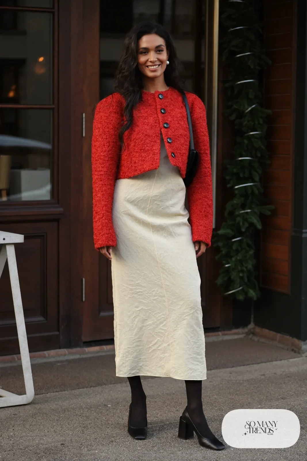 Red bouclé jacket over ivory crepe column dress with sheer tights and black pumps, outfit 4