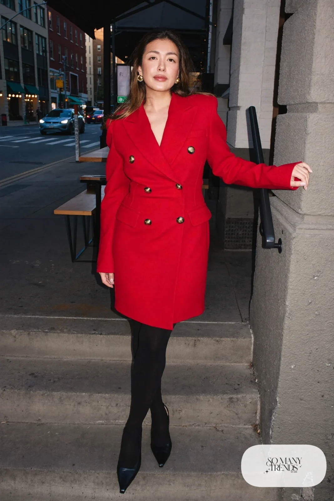 Woman in a red double-breasted blazer dress, sheer black tights and black pumps, look 18