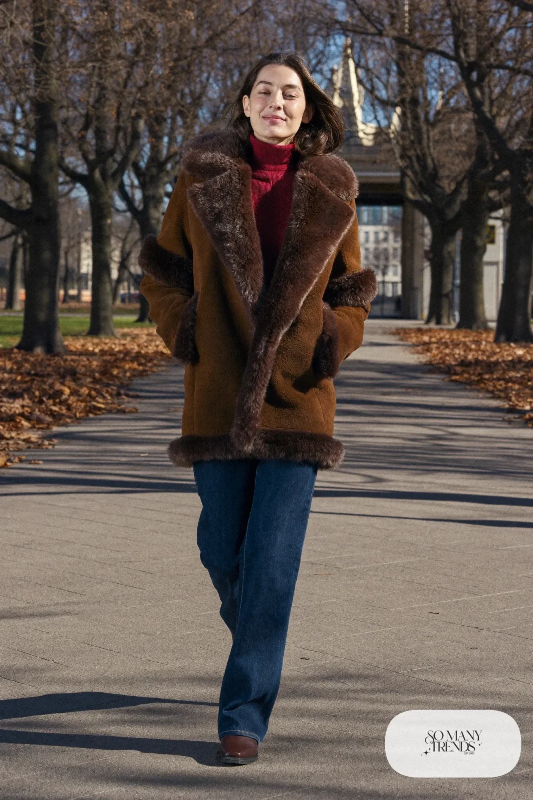 Woman in a brown shearling jacket, wine turtleneck, dark straight jeans and lug-sole boots, outfit 10