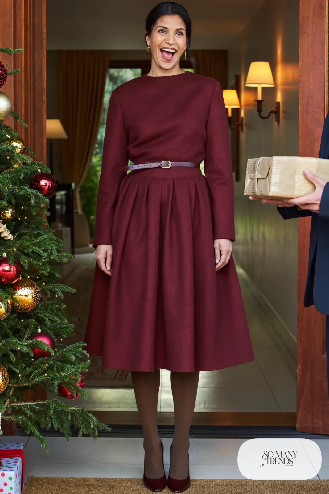 Woman in a wine wool midi dress with brown belt, sheer tights and closed-toe brown pumps, outfit 27