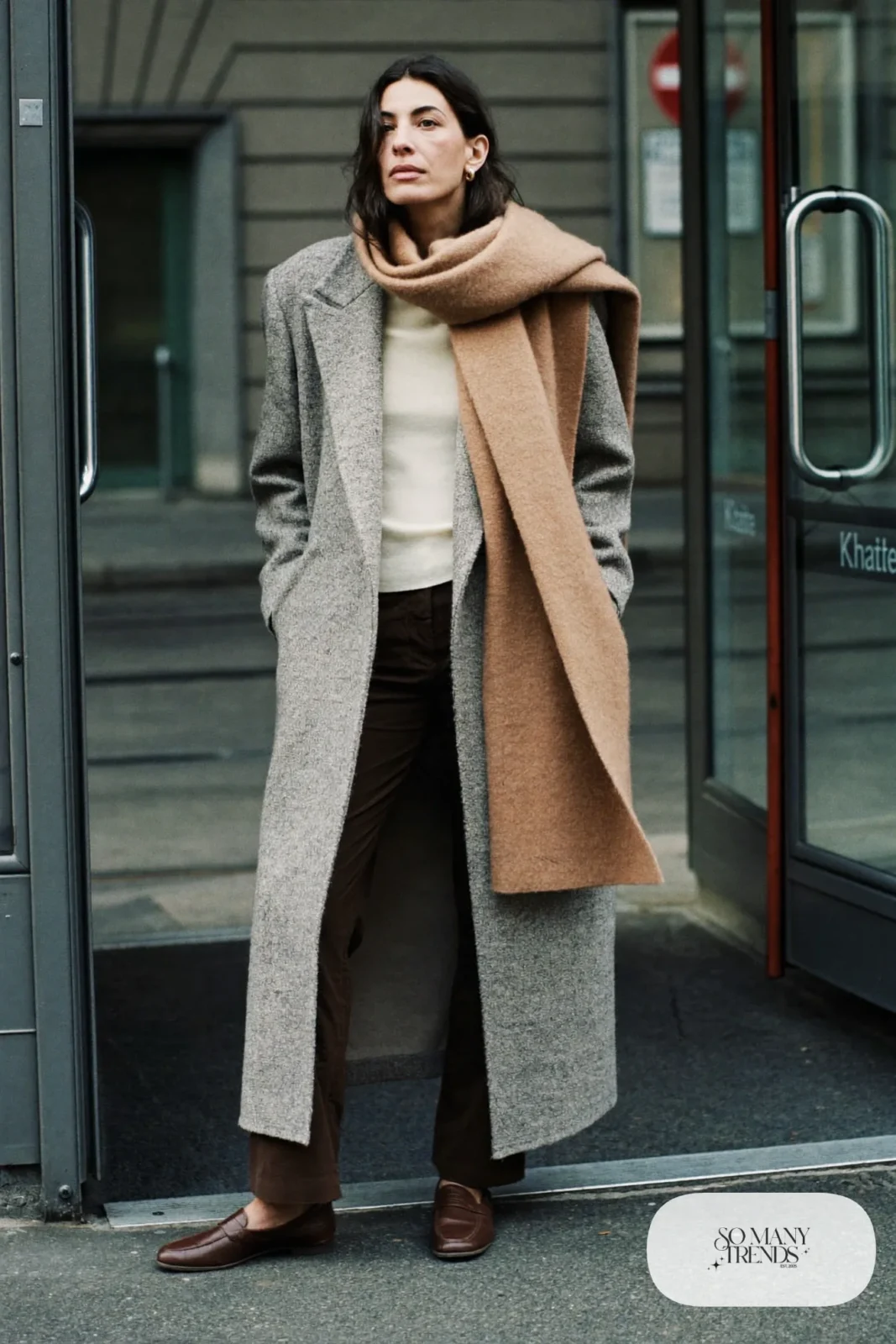 Heather gray wool overcoat, camel scarf, cream knit, chocolate pants and brown loafers, outfit 11